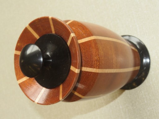 This segmented lidded box won a turning of the month for Ken Akrill